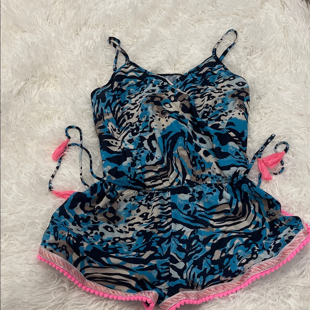 Super cute one piece with elastic waist and short bottom. Hot pink accents.